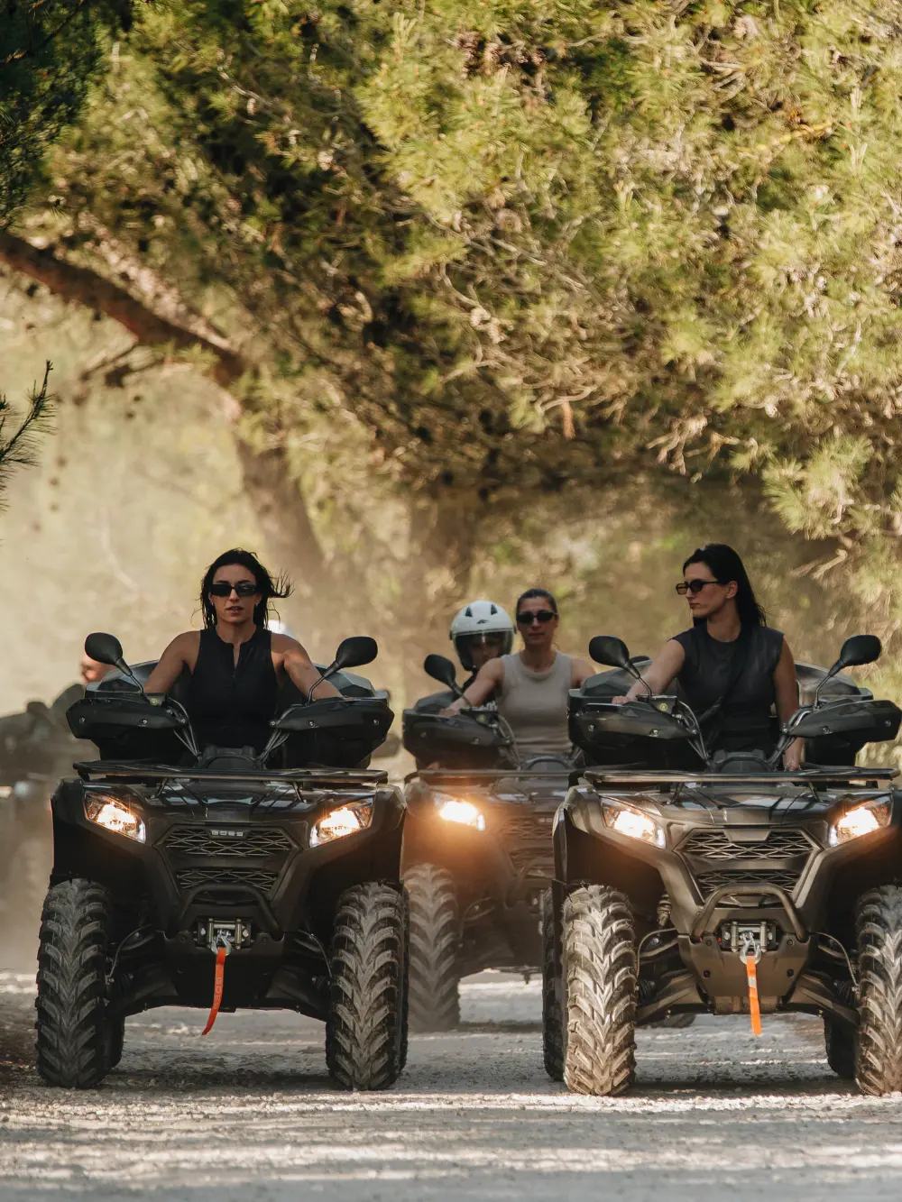 friends riding on an atv in premantura